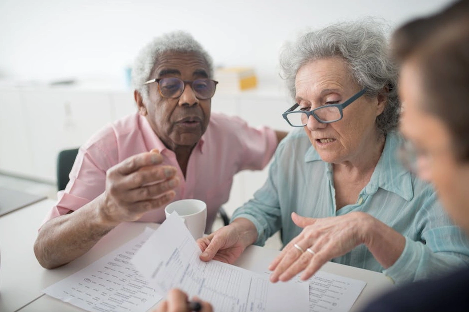 A financial advisor discussing a growth chart with a client.